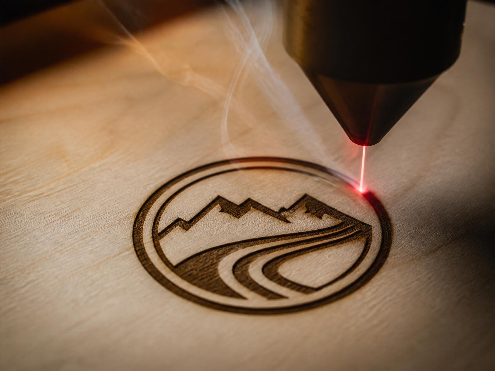 Laser engraving in progress on basswood